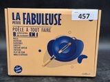the box of a blue frying pan with a spatula on it