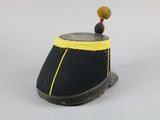 a black hat with yellow trim and a yellow pom pom on top of it
