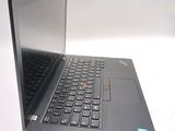 a laptop that is open on a white surface