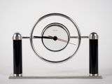 a clock that is sitting on top of a stand