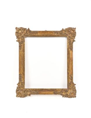 a gold frame with a white background and a white wall