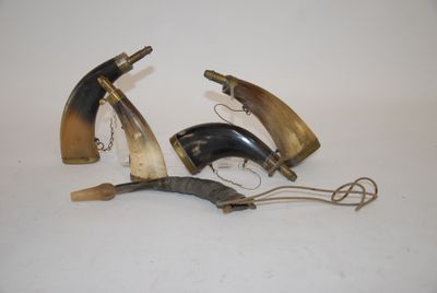 three horn horn shaped objects are on a white surface