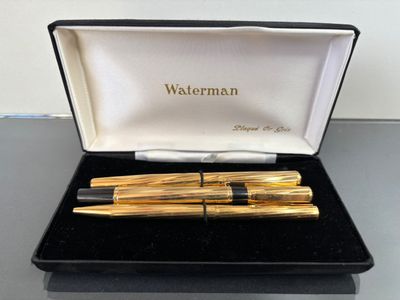 WATERMAN parure de trois stylos en métal doré, dans leur écr…