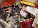 a pile of books sitting on top of a table