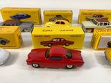 several toy cars are lined up next to each other on a table