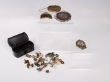 a small box with a bunch of jewelry inside of it
