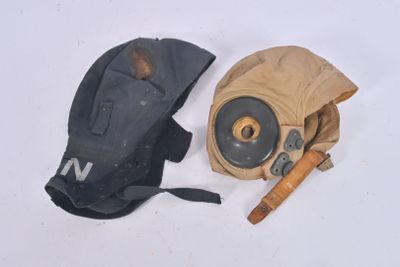 a glove and a gas mask on a white surface