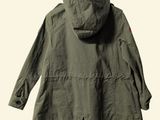 the jacket is green and has a hood on it