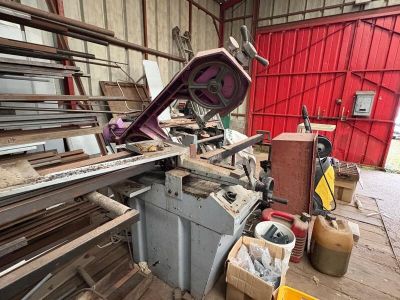 a large machine that is cutting wood in a building