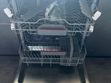 an image of a dishwasher with the door open in a kitchen