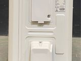 an image of a white refrigerator in a room