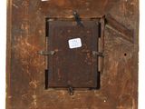 an old wooden picture frame with stickers attached to it