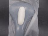 a plastic bag with a blue and white object inside of it