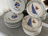 a lot of plates that are sitting on a counter