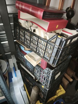 a stack of books sitting on top of a stack of crates