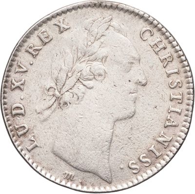 gros plan d'une pièce de monnaie sur fond blanc