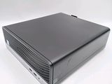 an image of a black computer on a white surface