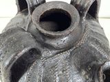 a black vase that is sitting on a table