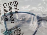 a plastic bag with a pair of glasses inside of it