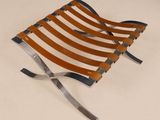 an image of a leather folding chair on a white surface