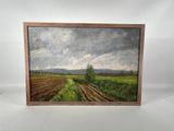 painting of a field with a lone tree in the middle of it