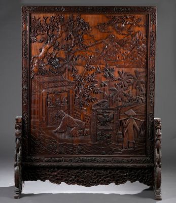 an antique carved wooden screen with birds and flowers on it