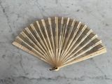 a fan that is sitting on a marble table