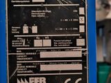 a sign on the side of a blue machine