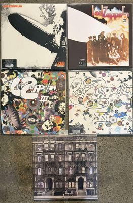 the led zeppelin albums are laid out on the floor