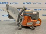 a close up of a chainsaw sitting on top of a table