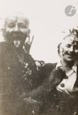 an old photo of a man and a woman sitting together