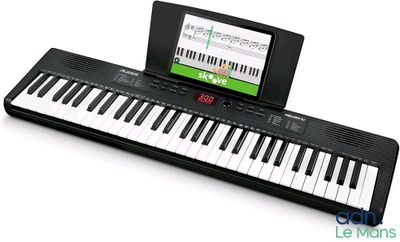 a small electronic keyboard with a tablet on it