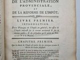 an open book with a black and white image of a cross on it
