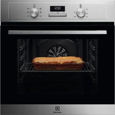 an oven with a loaf of bread in it sitting inside of it