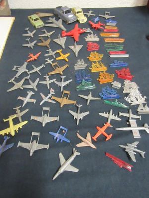 a lot of toy airplanes that are on the table