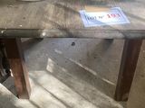a vase of flowers sitting on top of a wooden table