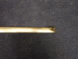 a metal bar that is on the floor next to a carpet