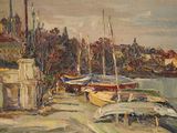 many boats that are sitting on the shore of the water