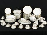 a picture of a group of white and gold dinnerware
