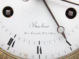 a close up of a clock with roman numerals on it