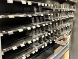 many empty shelves in a store with no people