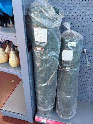 two bags of toiletries sitting on a shelf in a store