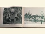 a book opened to show a picture of a city
