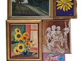 many paintings on the wall of this room