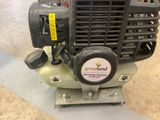 a small air compressor sitting on top of a table