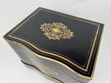 an image of a black and gold box on a white surface