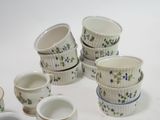 a lot of cups that are sitting on a table