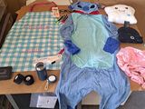 a stuffed animal sitting on top of a table next to other items