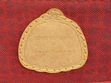 a louis vuitton red and gold monogramet bag