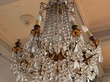 a chandelier hanging from the ceiling in a room